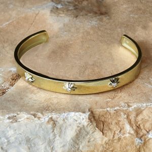 Golden bangle with three suns